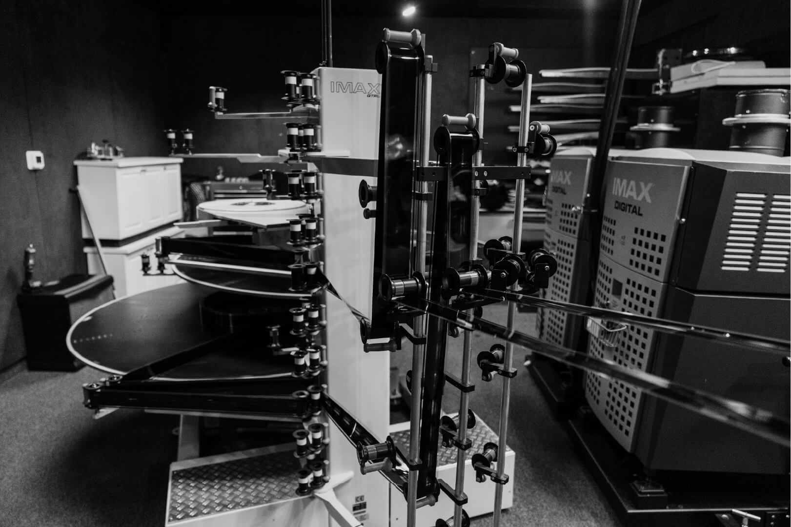 A Celebration Cinema projectionist threading the IMAX 70MM projector